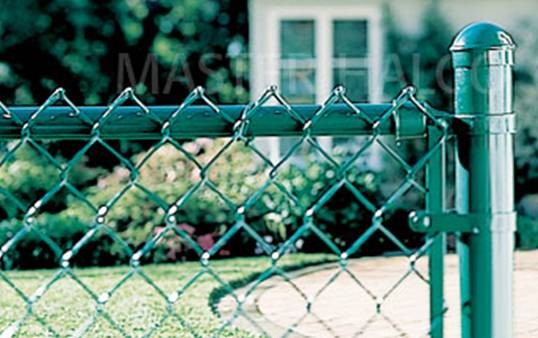 Chain link fence installation with a Heiar Fencing sign