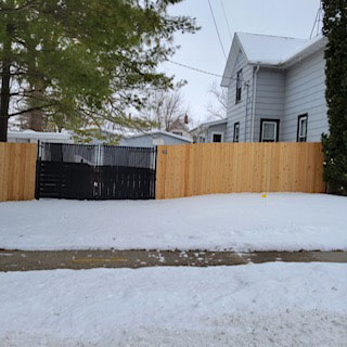 Finished cedar privacy fence at a residential property