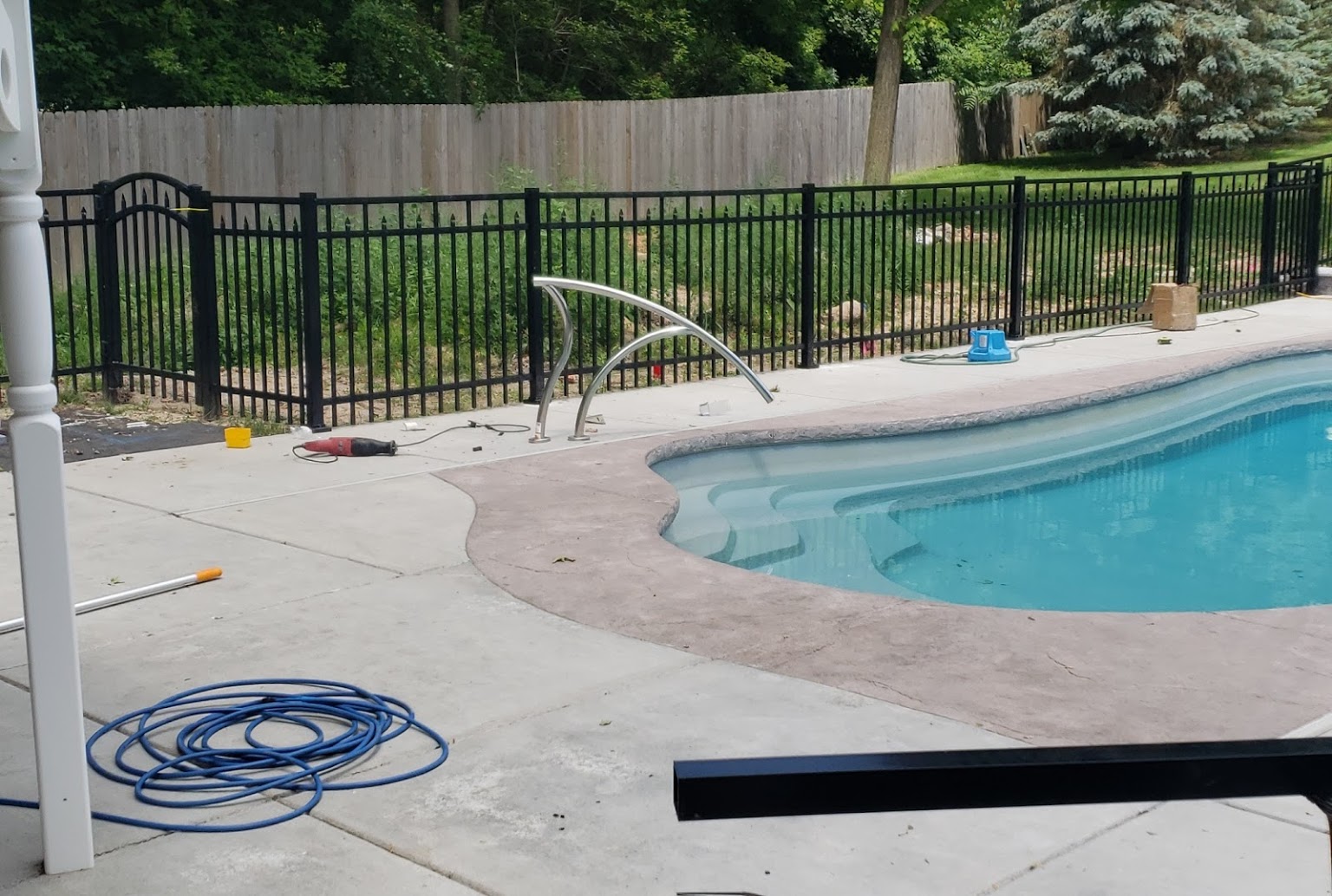 Black ornamental fence line along a residential frontage