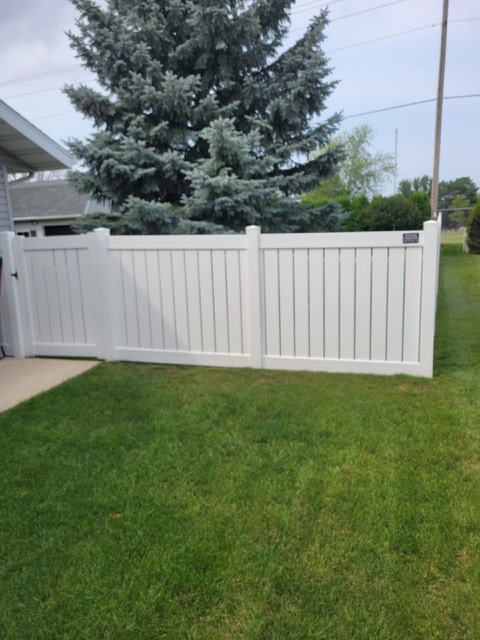 Finished vinyl fence project with a long straight run