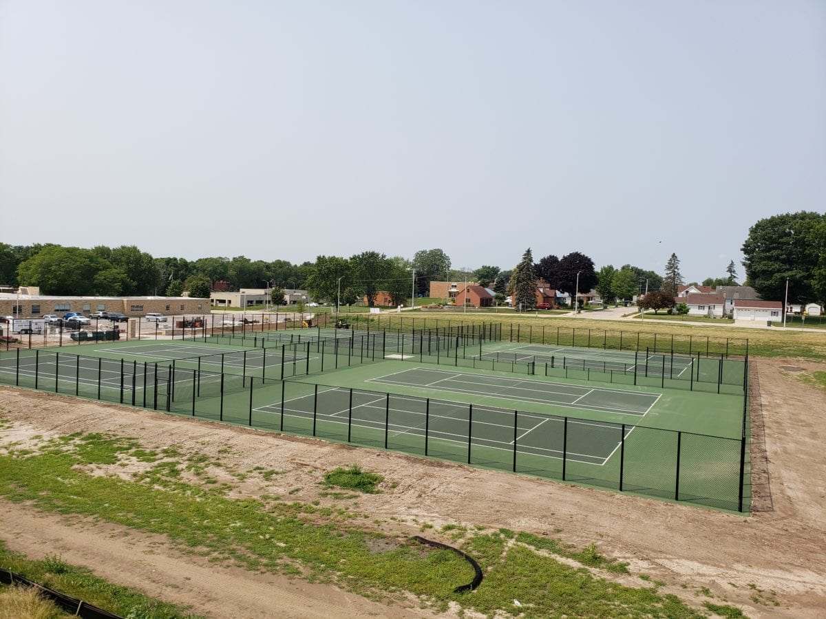Long run of chain link fence bordering a property