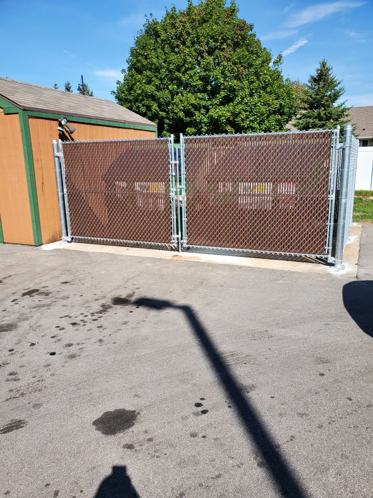 Green-coated chain link fence detail