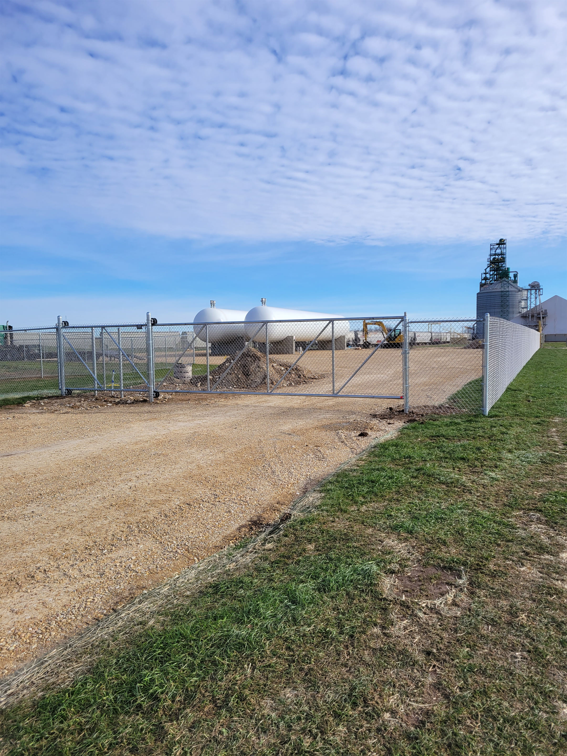 Residential chain link fence installed along a property edge