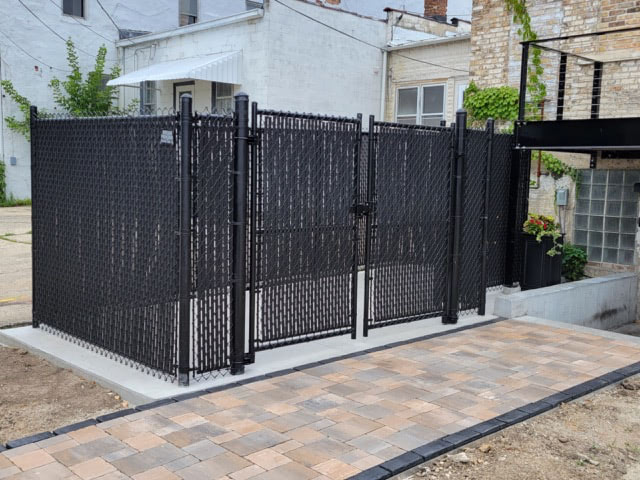 Chain link fence and gate setup at a residential lot