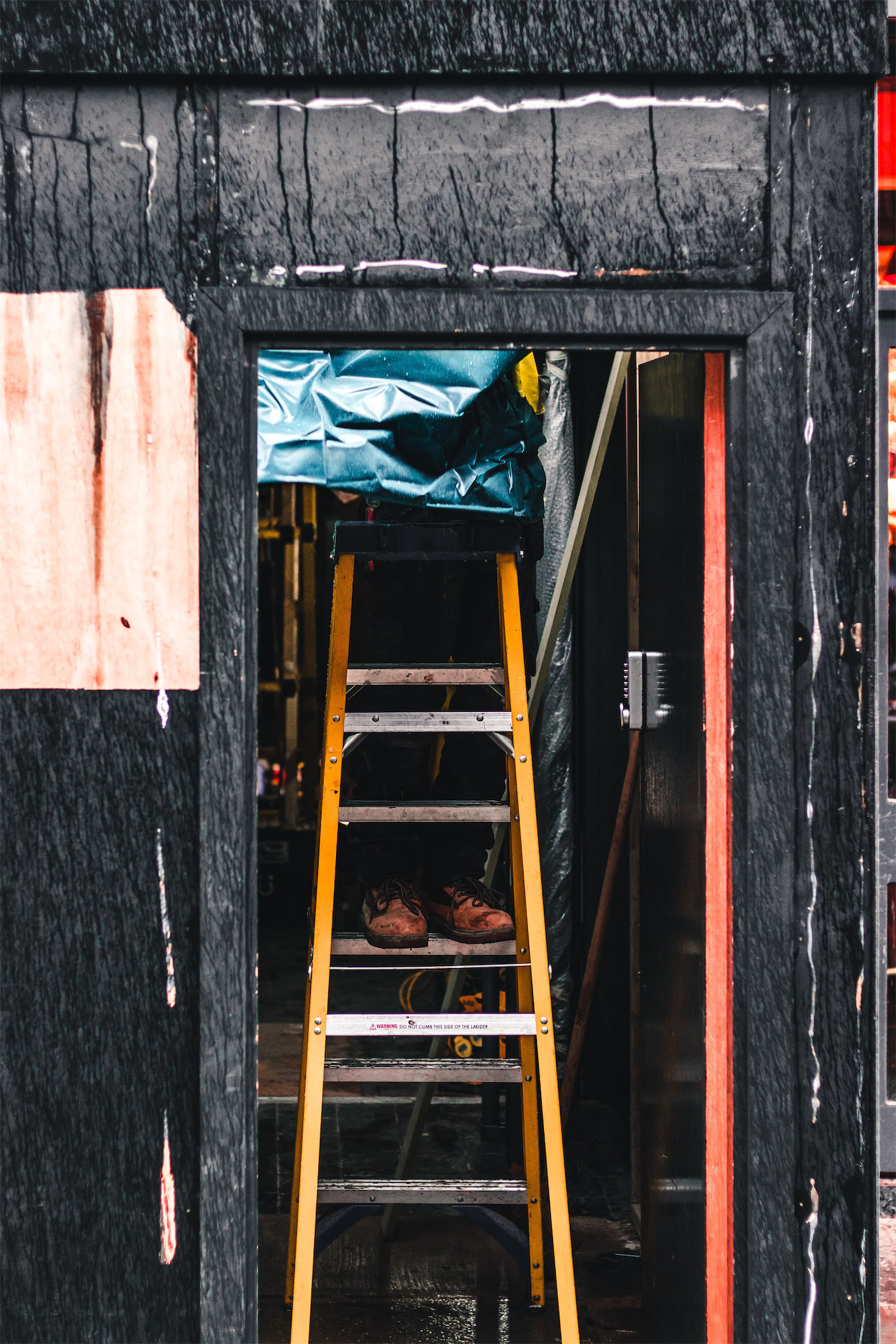 Ladder and site access setup representing on-site property maintenance work