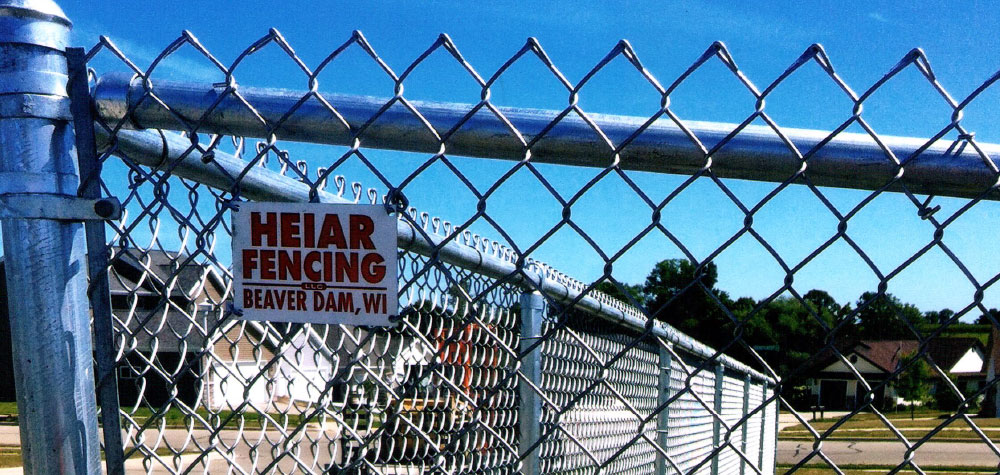 Chain link fence installed near a neighborhood street
